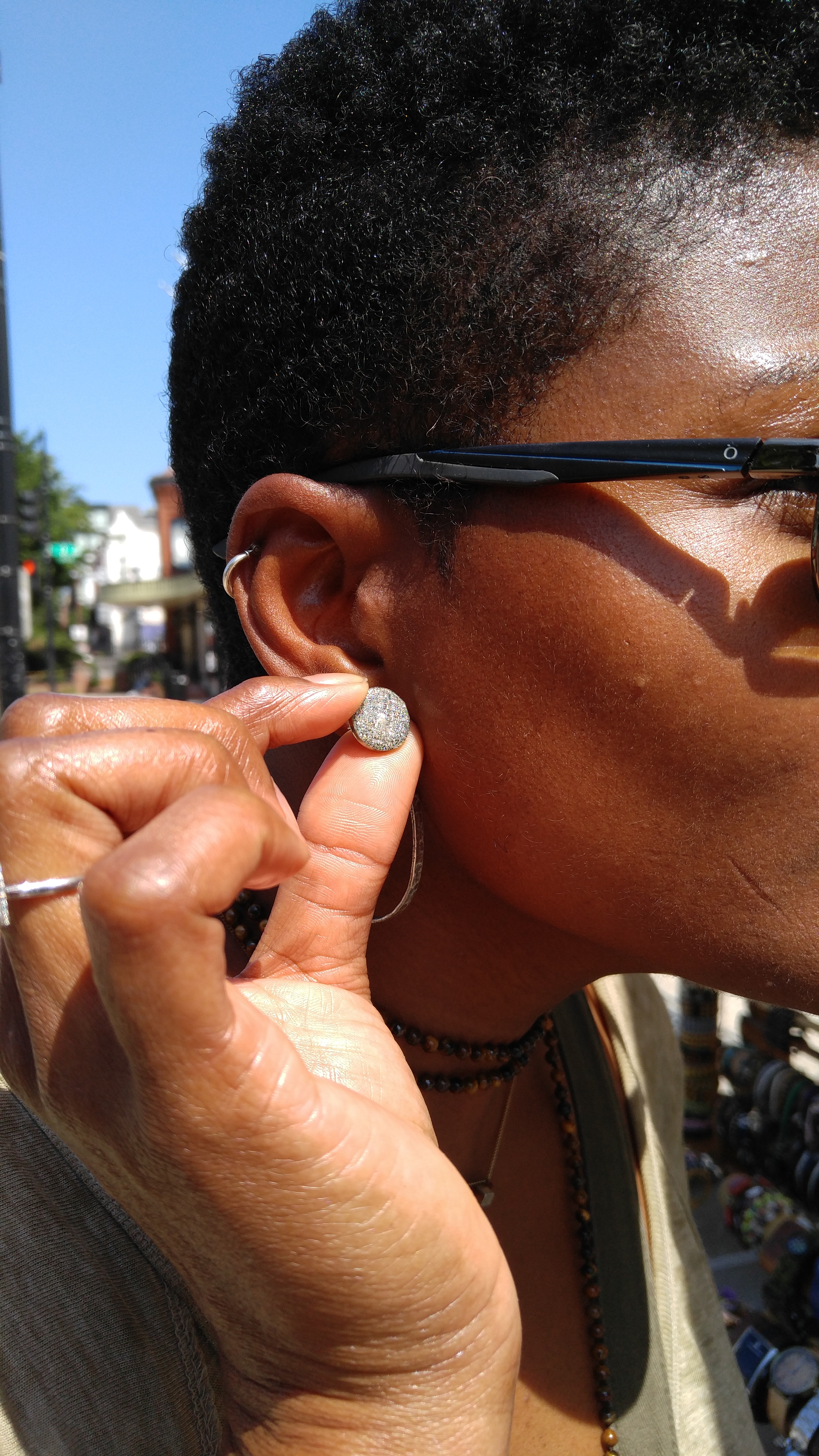 Customer admires her New Nikus stud earrings, Sept. 2016