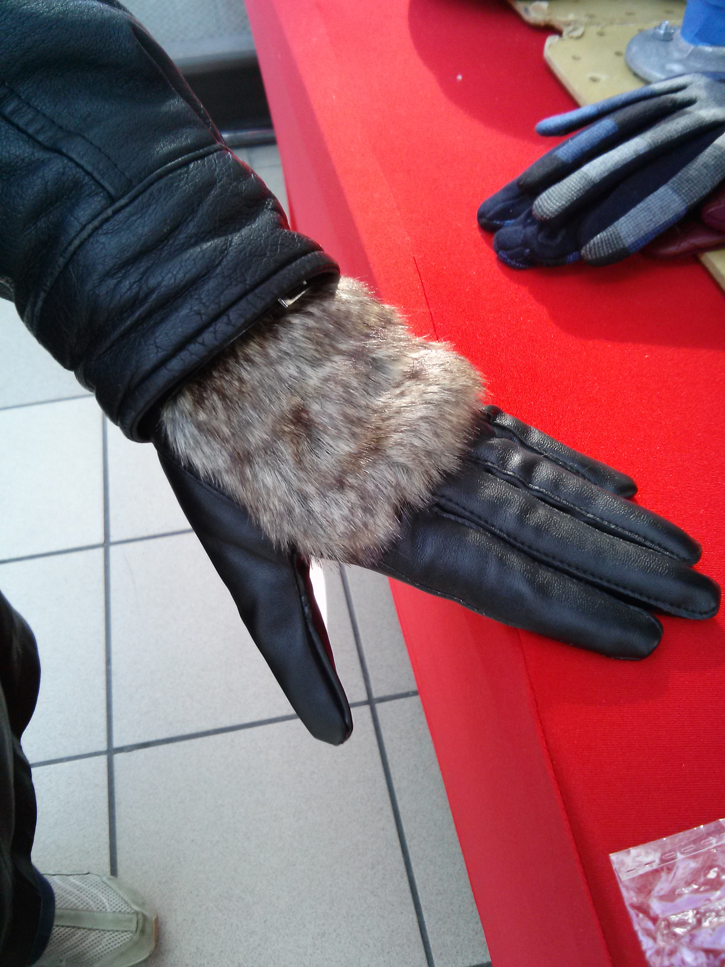 Customer tries on Leather Gloves with Faux Fur @ Airforce Base